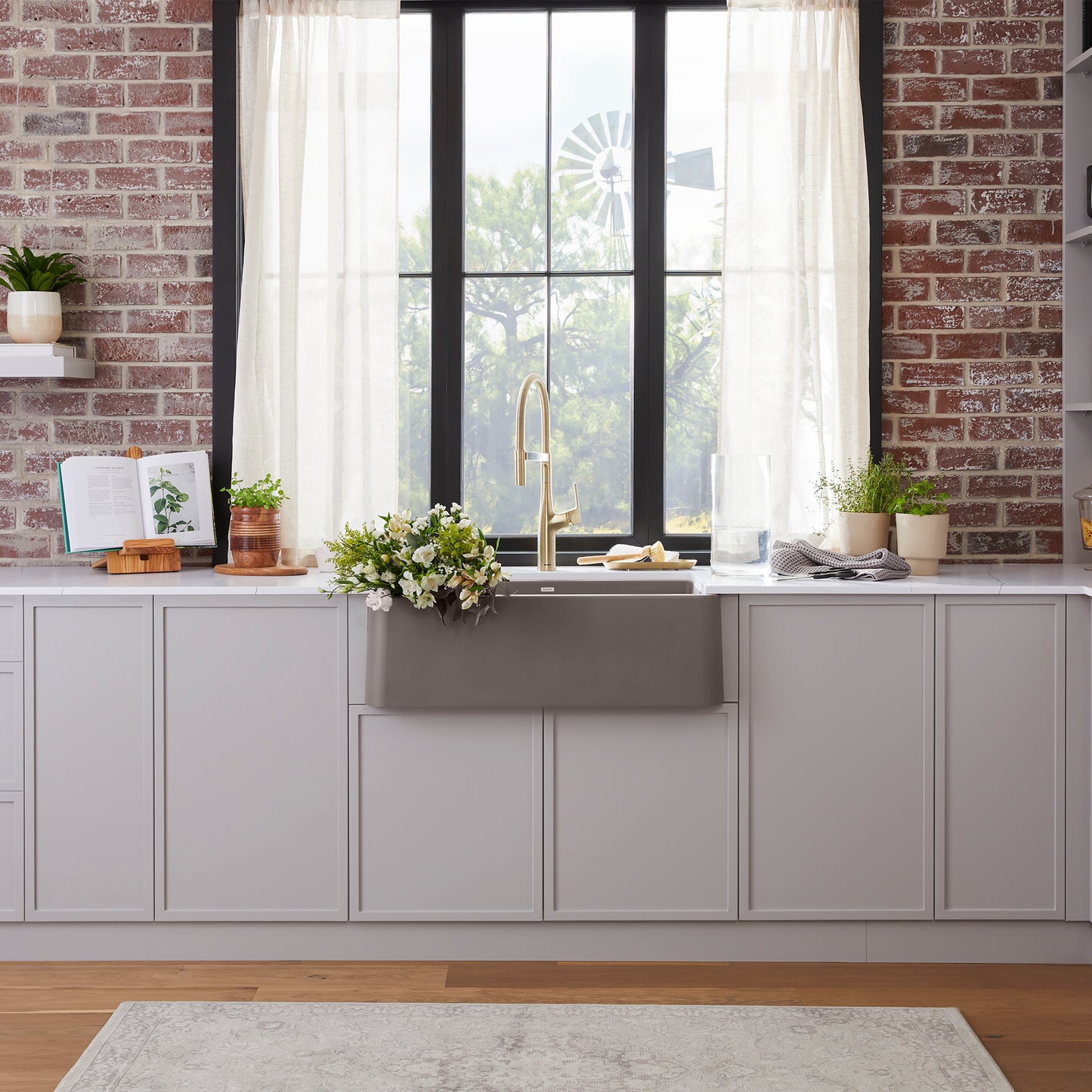 BLANCO Ikon SILGRANIT 30" Single Bowl Apron-Front Farmhouse Sink displayed in a stylish modern kitchen.