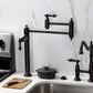 Kingston Brass KS3703AL Restoration Deck Mount Pot Filler Faucet, Antique Brass in a modern kitchen setting.