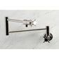 Kingston Brass KS4103DX Concord Wall Mount Pot Filler Faucet, Antique Brass with sleek cylindrical design.