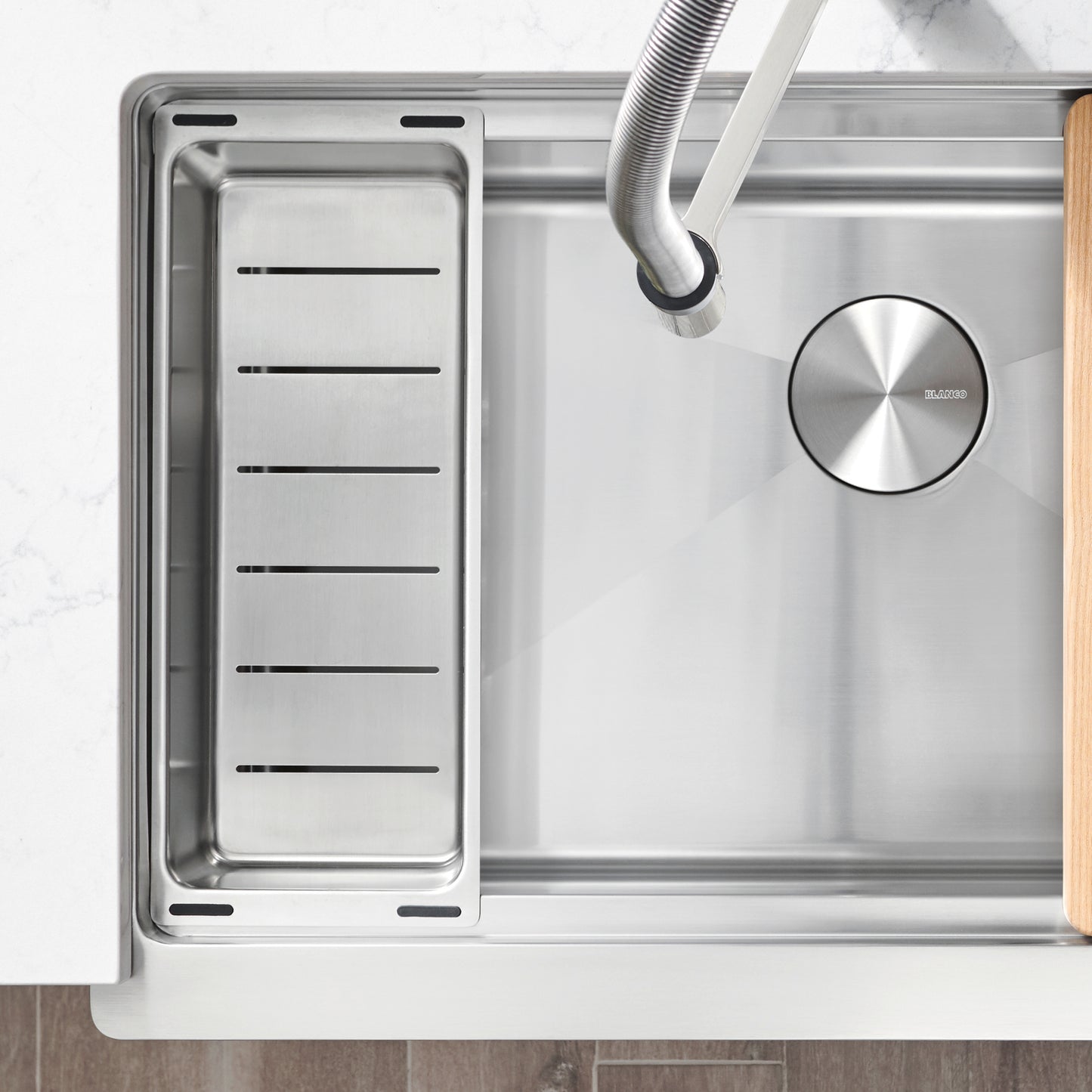 BLANCO Quatrus Ergon Colander integrated with ERGON workstation sink for efficient food preparation.
