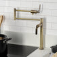 Kingston Brass KS4703KL Whitaker Deck Mount Pot Filler Faucet, Antique Brass in a modern kitchen setting.