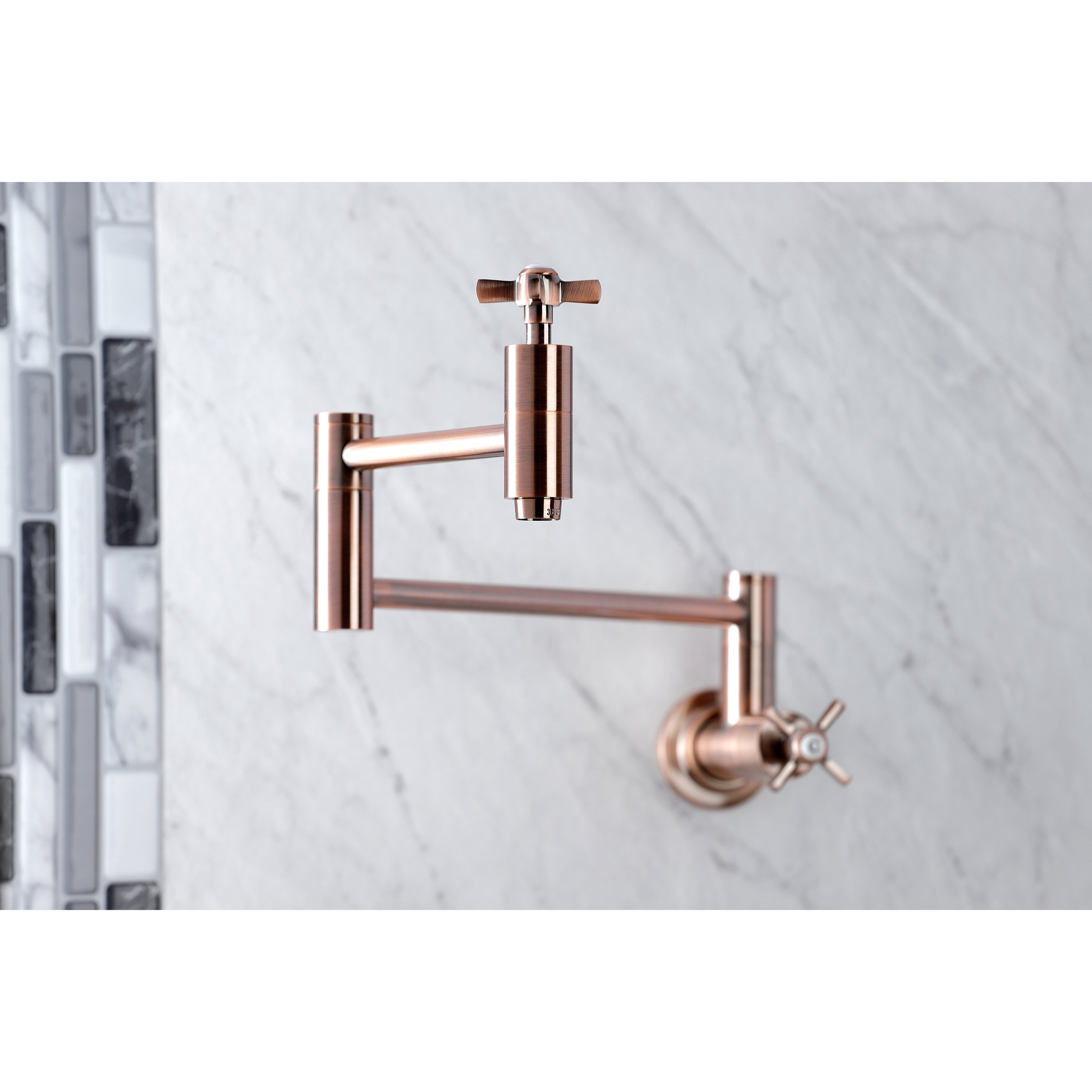 Kingston Brass KS8103ZX Millennium Wall Mount Pot Filler Faucet, Antique Brass mounted above a marble surface.