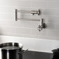 Kingston Brass KS4103RX Belknap Wall Mount Pot Filler Faucet, Antique Brass with foldable swing arms.