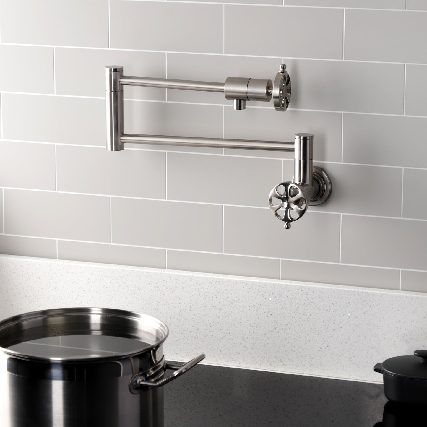 Kingston Brass KS4103RX Belknap Wall Mount Pot Filler Faucet, Antique Brass with foldable swing arms.