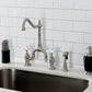 Kingston KS7758PXBS English Country Bridge Kitchen Faucet with Brass Sprayer, Brushed Nickel on a countertop.