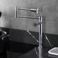 Kingston Brass KS4703RKZ Wendell Deck Mount Pot Filler Faucet with Knurled Handle, Antique Brass installed in a modern kitchen.