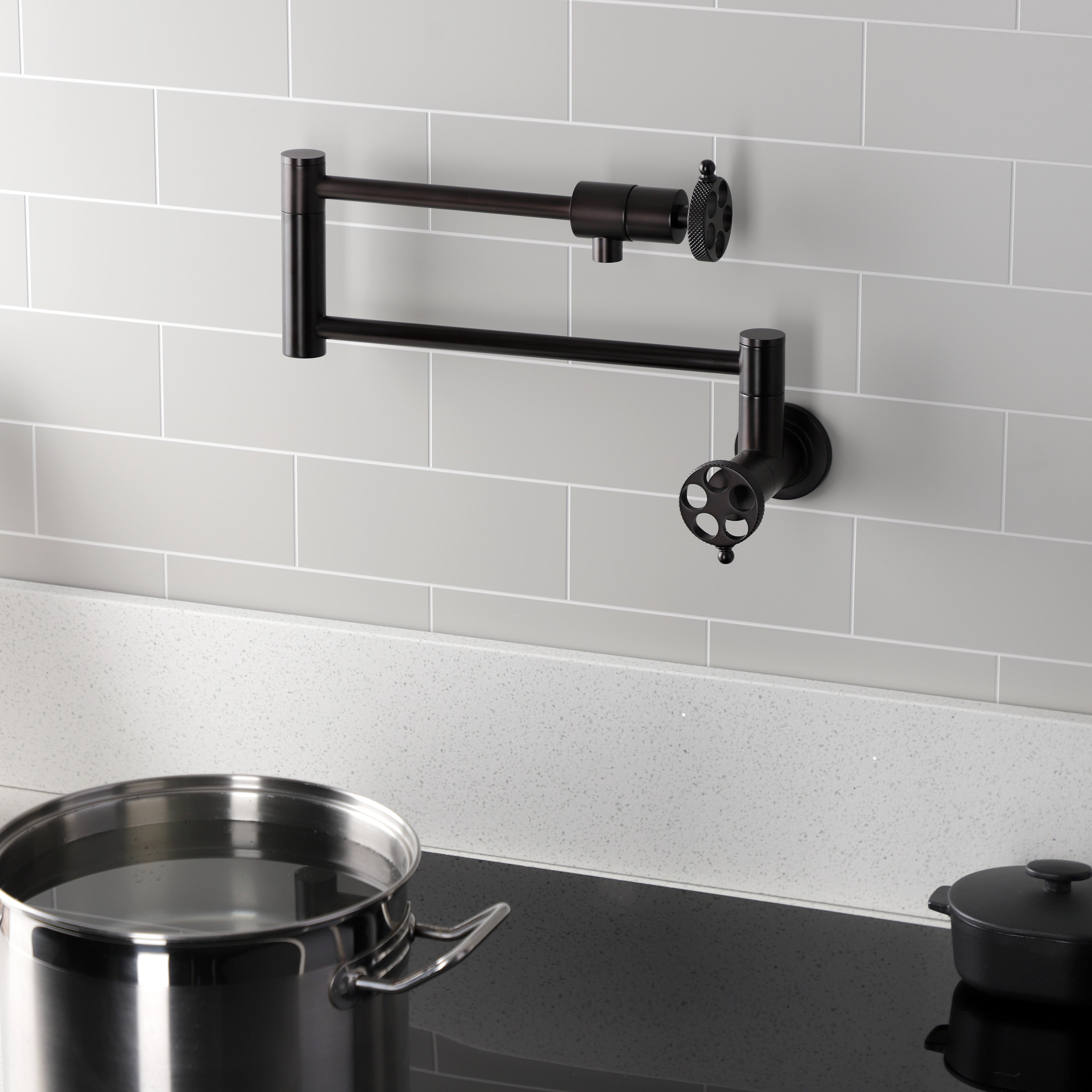 Kingston Brass KS4103RKX Webb Wall Mount Pot Filler Faucet with Knurled Handle, Antique Brass mounted in kitchen