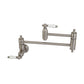 Kingston Brass KS3103PL Restoration Wall Mount Pot Filler Faucet, Antique Brass in brushed nickel finish with swing arms.