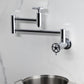 Kingston Brass KS8103CG Fuller Wall Mount Pot Filler Faucet, Antique Brass, featuring foldable swing arms for easy pot filling.