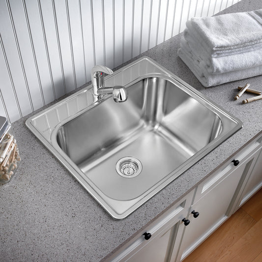 BLANCO Essential 25" Single Bowl Drop-In Stainless Steel Laundry Sink - 1 Hole installed in a laundry room with towels.