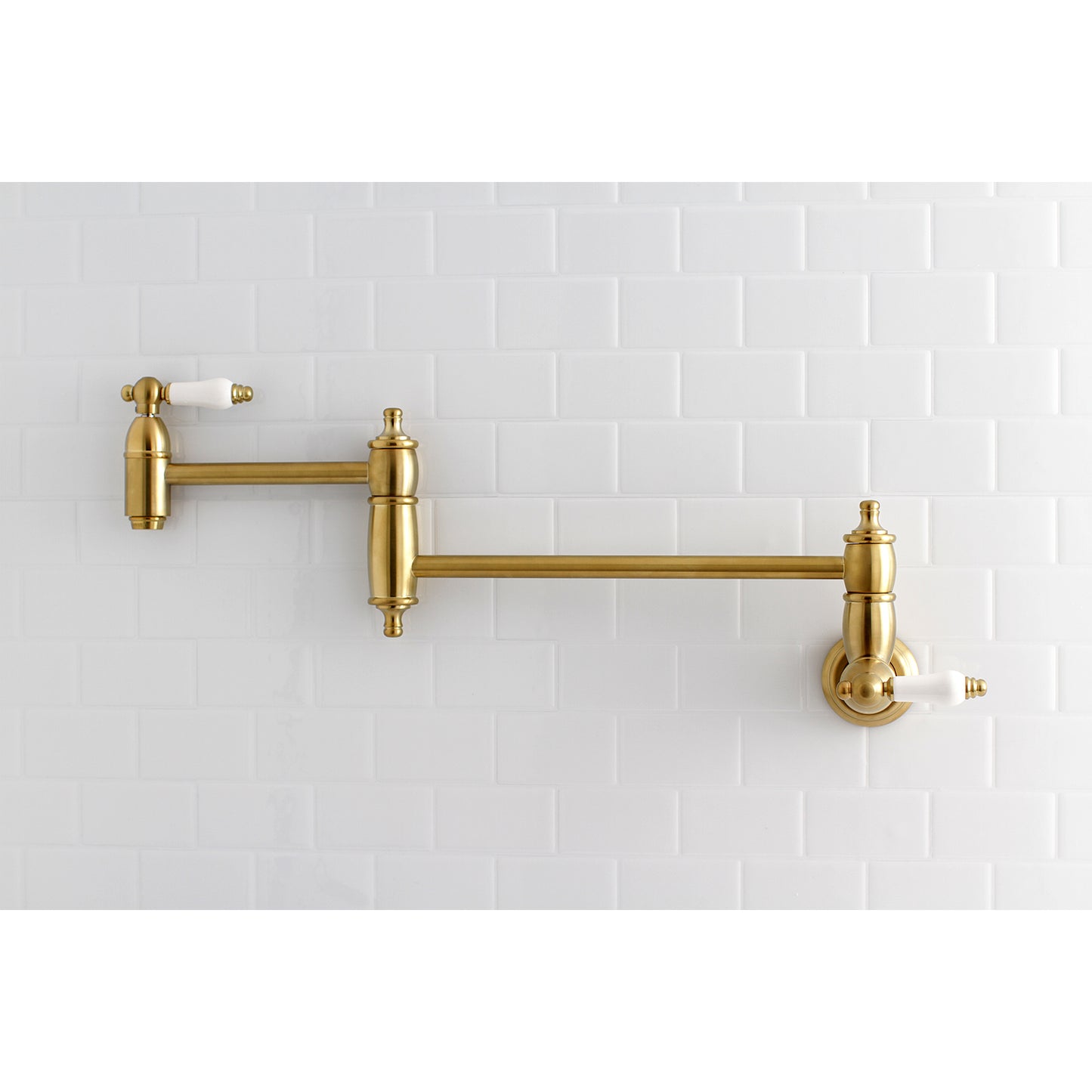 Kingston Brass KS3103PL Restoration Wall Mount Pot Filler Faucet, Antique Brass on tiled wall, traditional design