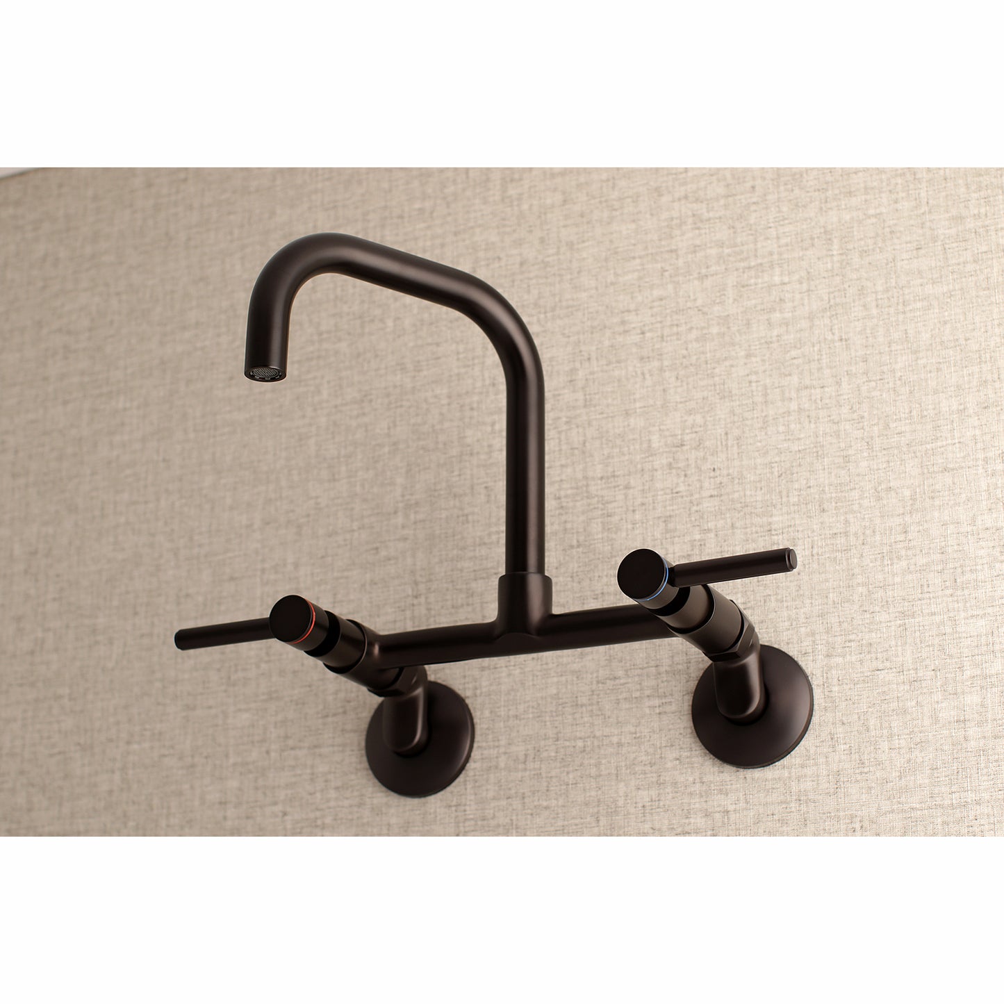 Kingston Brass KS813SB Concord Wall Mount Bridge Kitchen Faucet in modern wall mount design, viewed from the front.