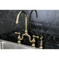 Kingston KS7793ALBS English Country Bridge Kitchen Faucet with Brass Sprayer, Antique Brass on black marble countertop.