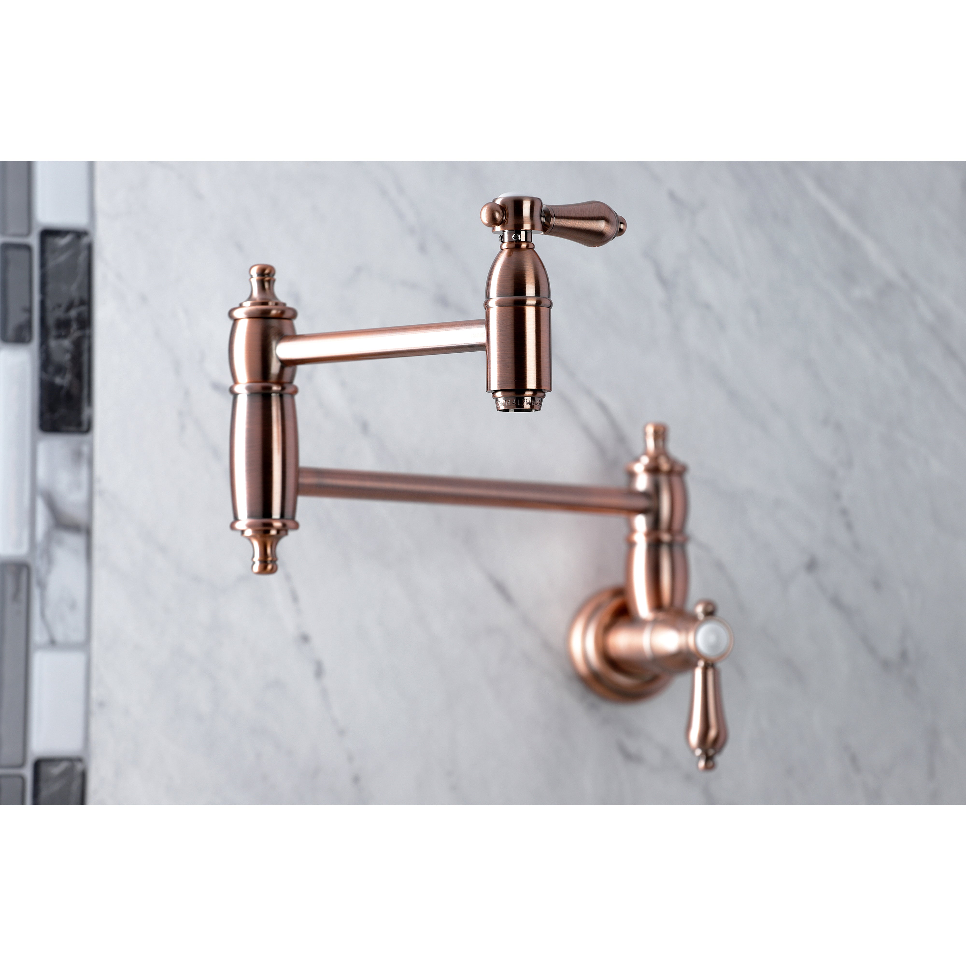 Kingston Brass KS3103BAL Heirloom Wall Mount Pot Filler Faucet, Antique Brass close-up on marble background