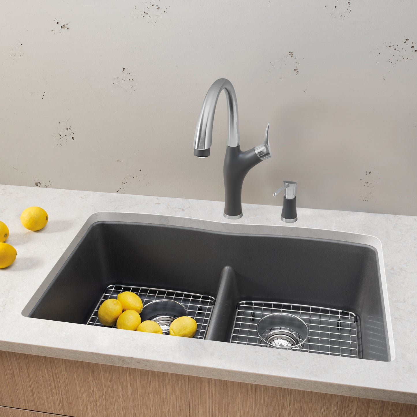 BLANCO Diamond SILGRANIT 32" 50/50 Double Bowl Undermount Kitchen Sink with Low Divide featuring lemons and faucet.
