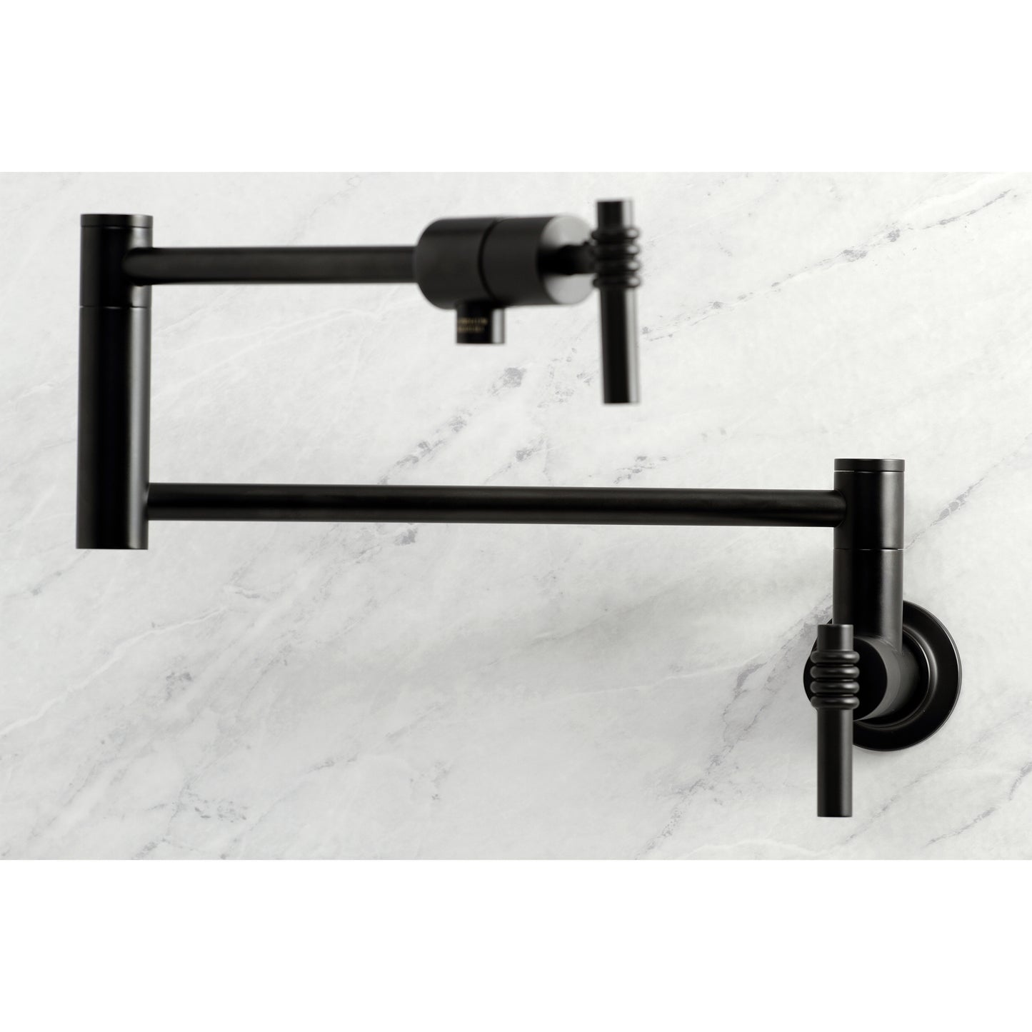 Kingston Brass KS4103ML Milano Wall Mount Pot Filler Faucet, Antique Brass close up on kitchen wall