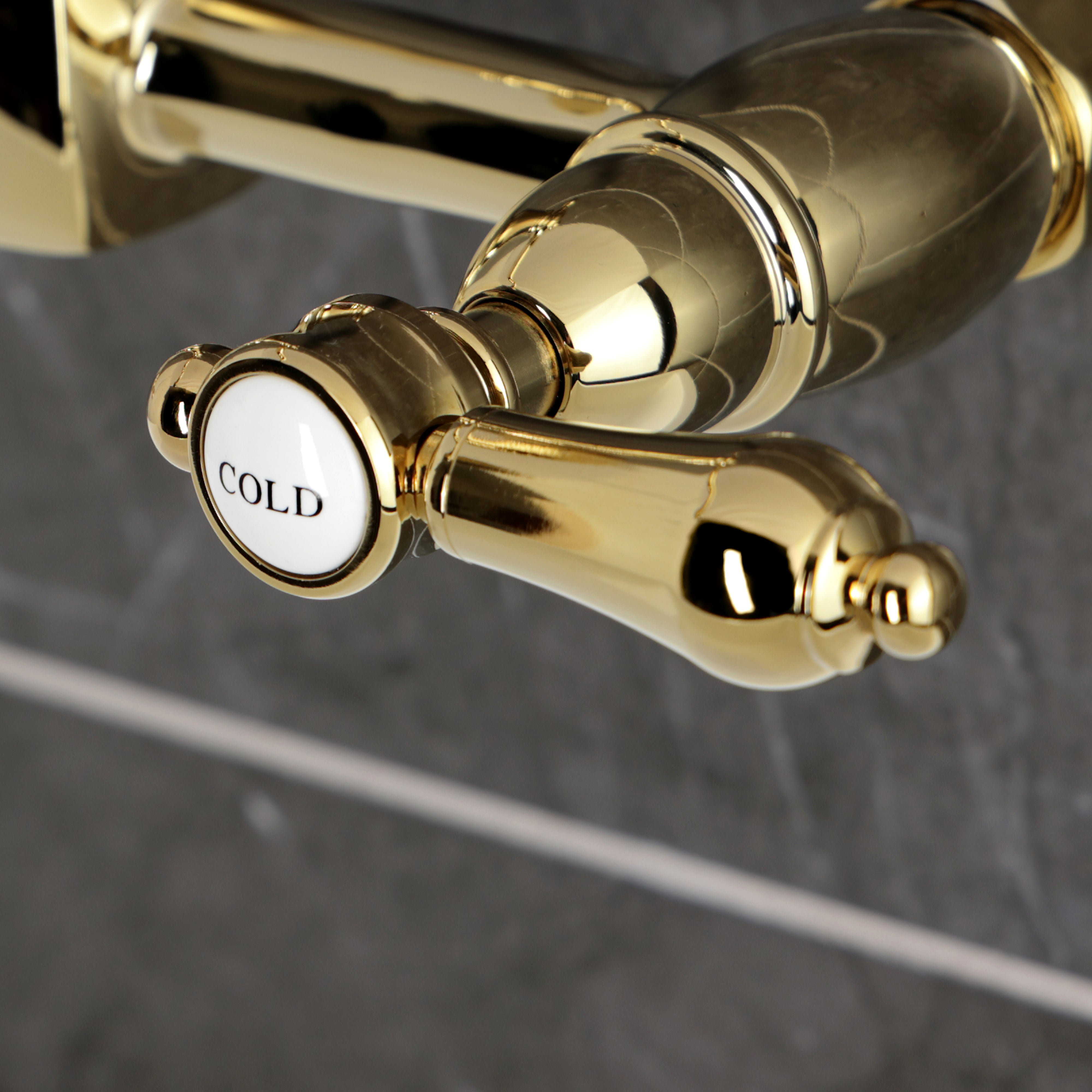 Kingston KS1263BAL Heirloom Two-Handle Wall Mount Bridge Kitchen Faucet, Antique Brass cold handle close-up