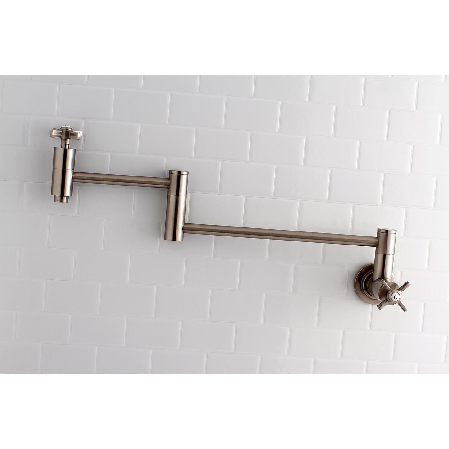 Kingston Brass KS8103ZX Millennium Wall Mount Pot Filler Faucet, Antique Brass mounted on wall