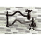 Kingston Brass KS2107AX Heritage Wall Mount Pot Filler Faucet, Brushed Brass, wall-mounted with foldable swing arms.