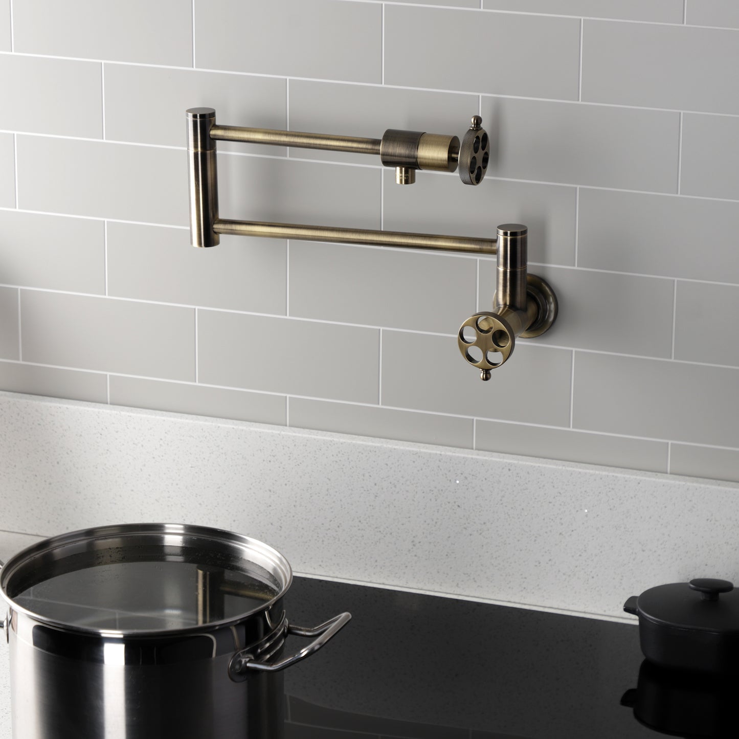 Kingston Brass KS4103RKZ Wendell Wall Mount Pot Filler Faucet with Knurled Handle, Antique Brass in kitchen setting