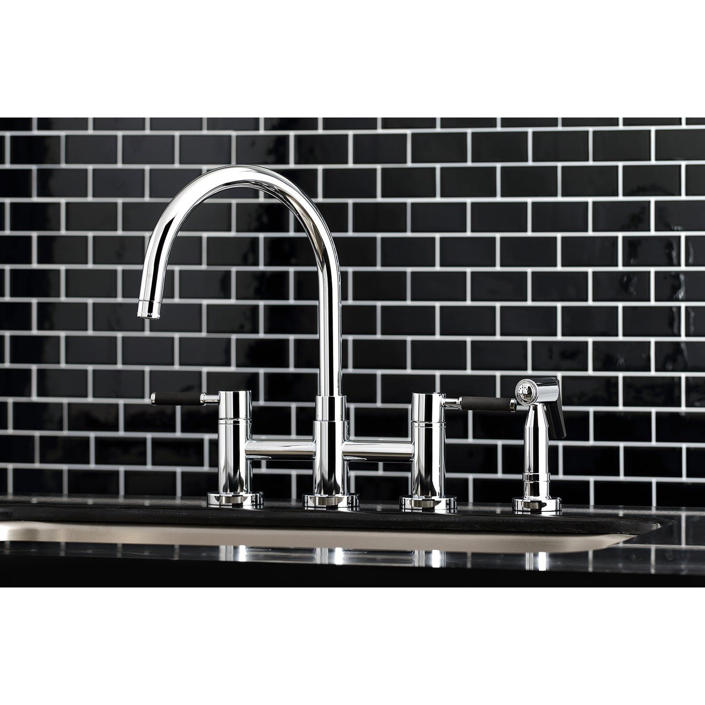 Kingston KS8278DKLBS Kaiser Bridge Kitchen Faucet with Brass Sprayer, Brushed Nickel on black tiled wall.