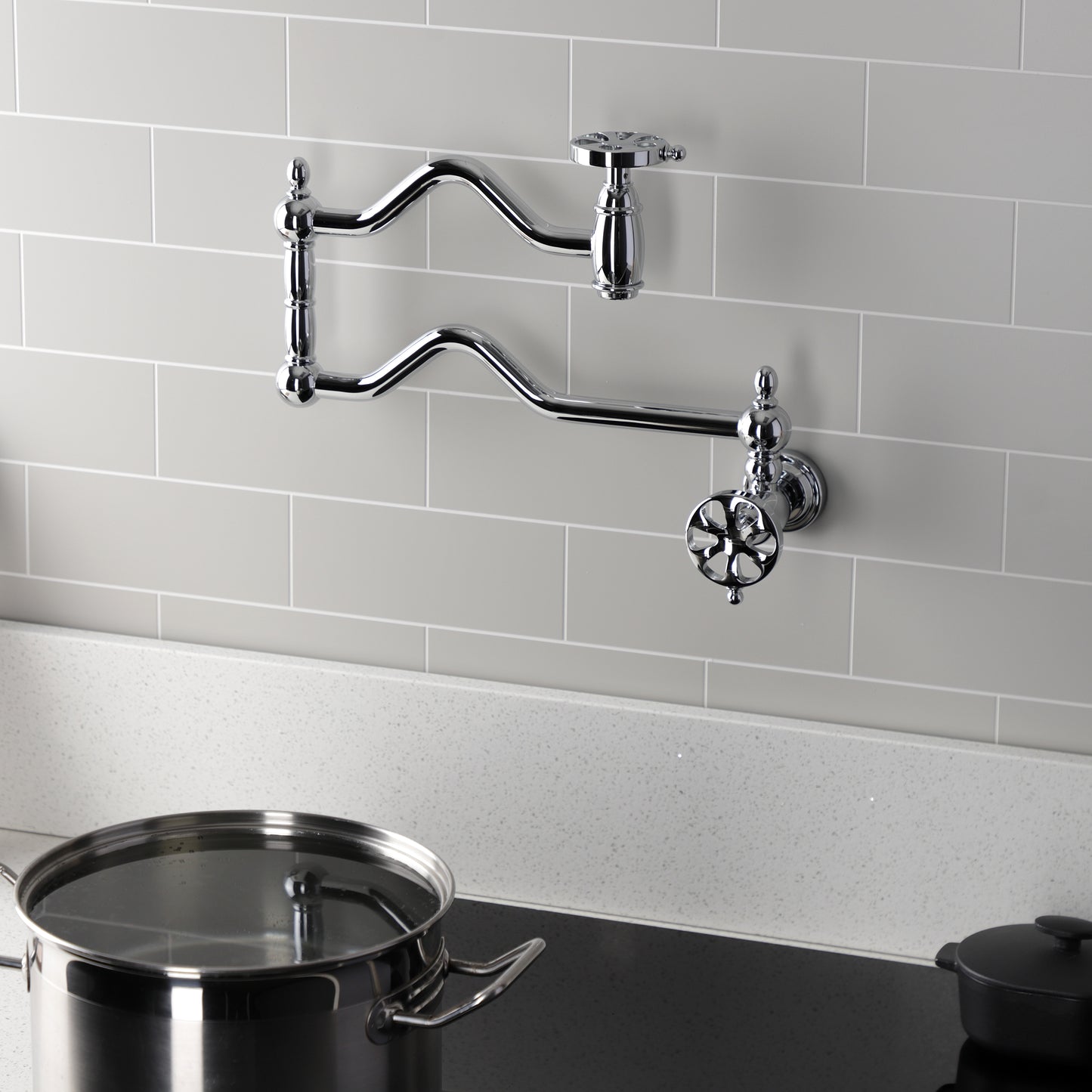 Kingston Brass KS2107RX Belknap Wall Mount Pot Filler Faucet, Brushed Brass in modern kitchen setting.