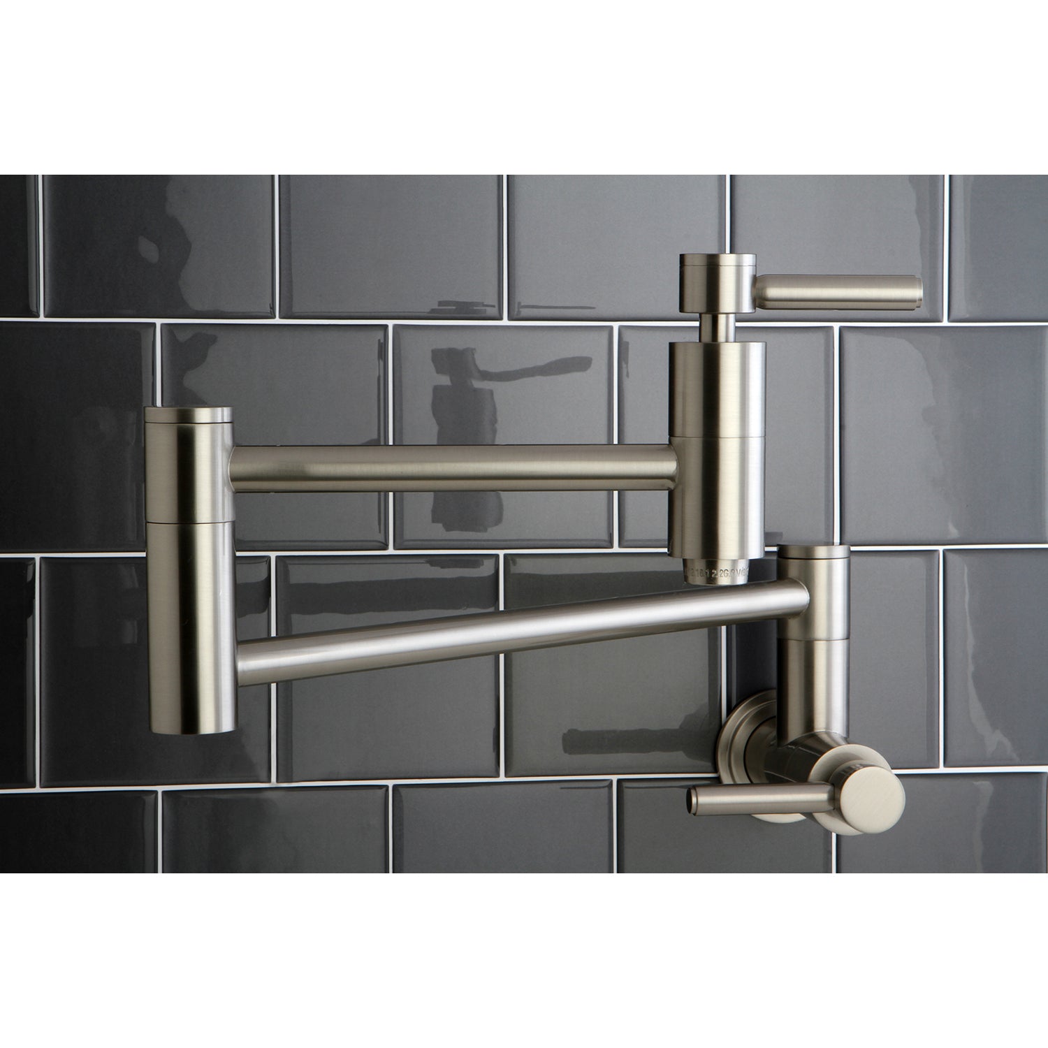 Kingston Brass KS8103DL Concord Wall Mount Pot Filler Faucet, Antique Brass against modern tile backsplash.