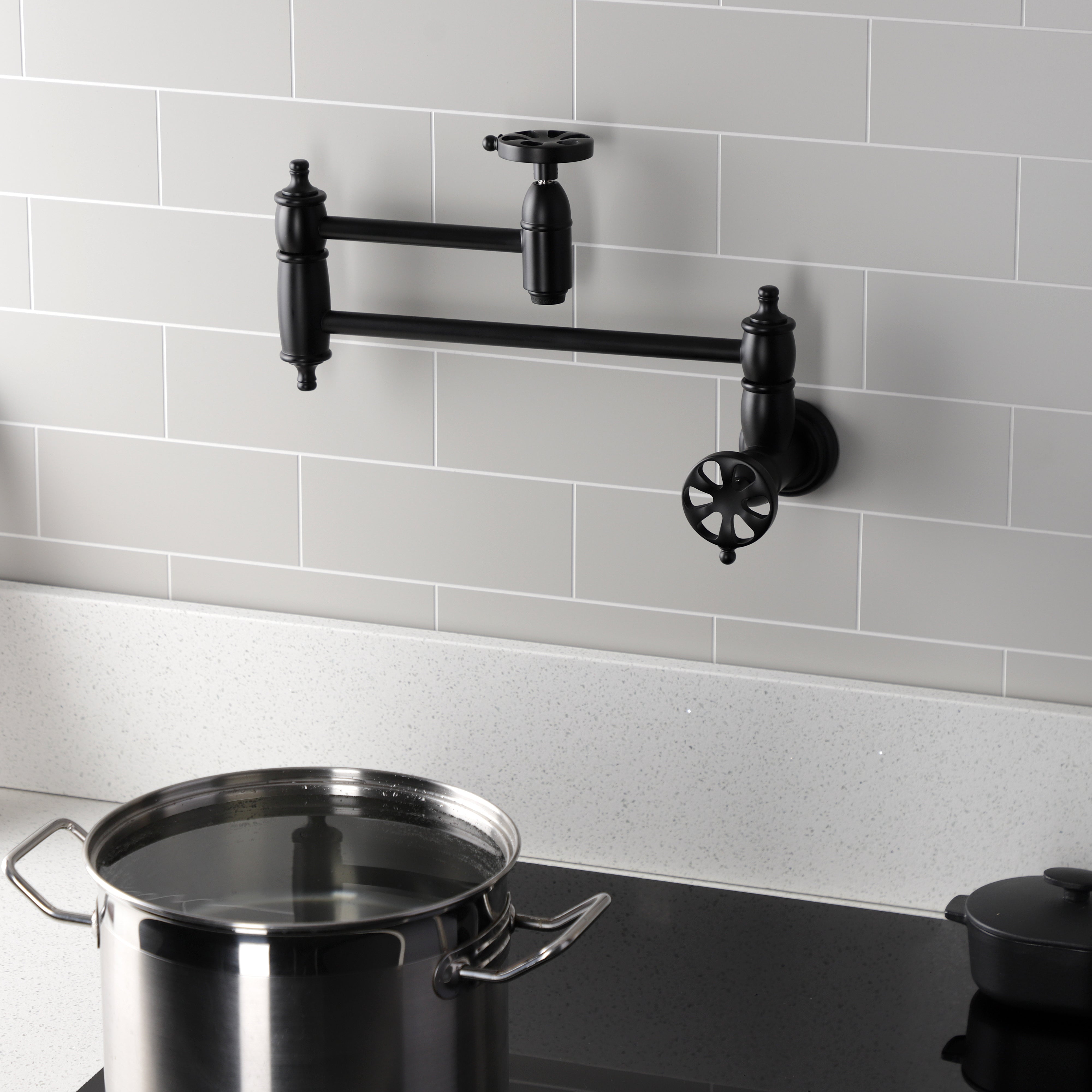 Kingston Brass KS3103RX Belknap Wall Mount Pot Filler Faucet, Antique Brass with stylish design and foldable swing arms.