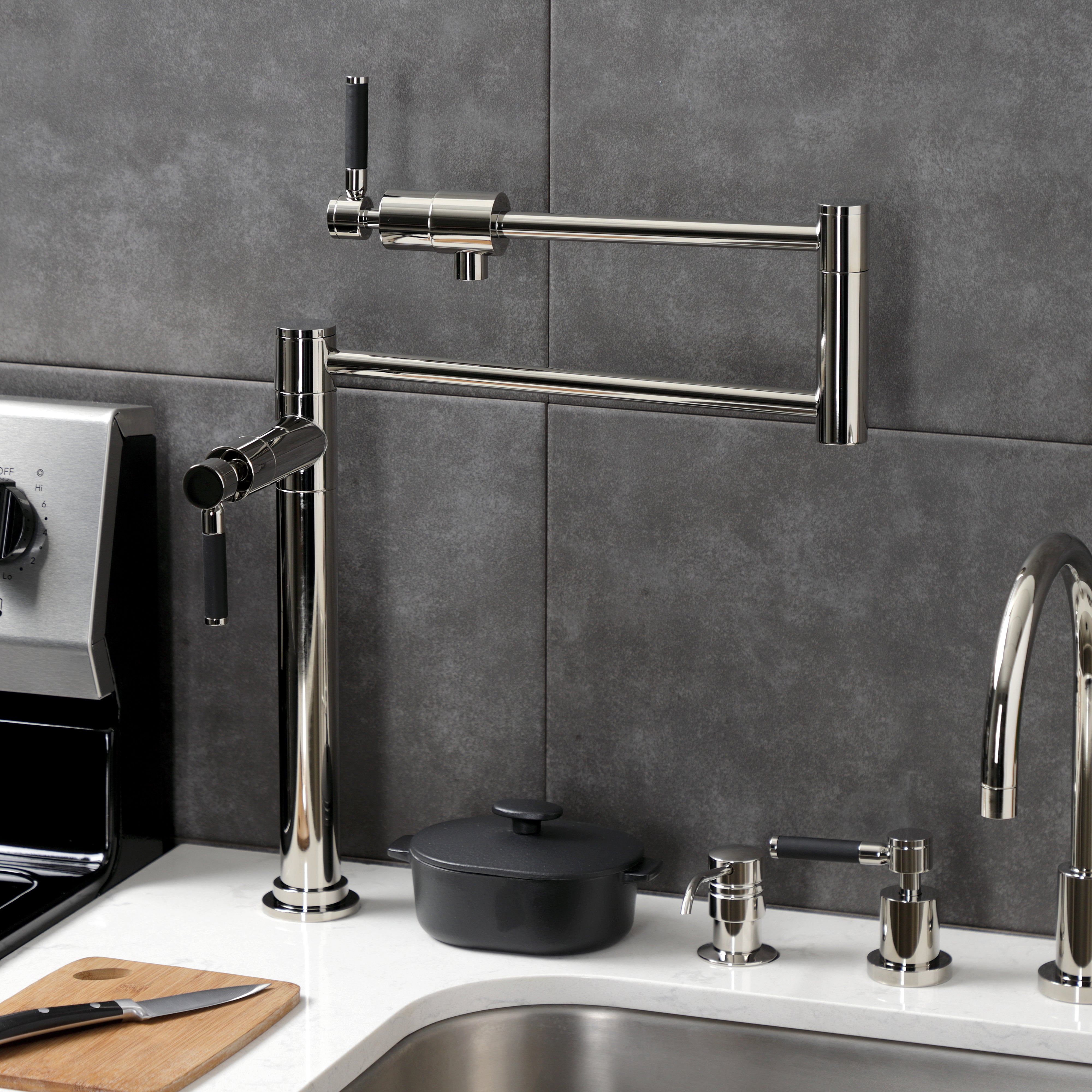 Kingston Brass KS4703DKL Kaiser Deck Mount Pot Filler Faucet, Antique Brass in a modern kitchen setting.
