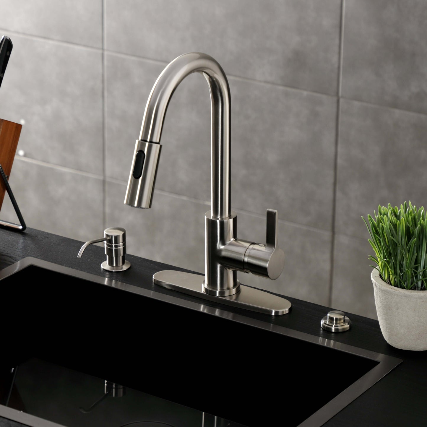 Kingston Brass LS8783CTL Continental Pull-Down Kitchen Faucet close-up view from above, showing modern high-arc design and single-handle operation.