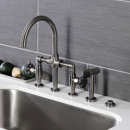Kingston KS2334CG Fuller Industrial Style Bridge Kitchen Faucet with Brass Sprayer, Black Stainless installed in a modern kitchen.