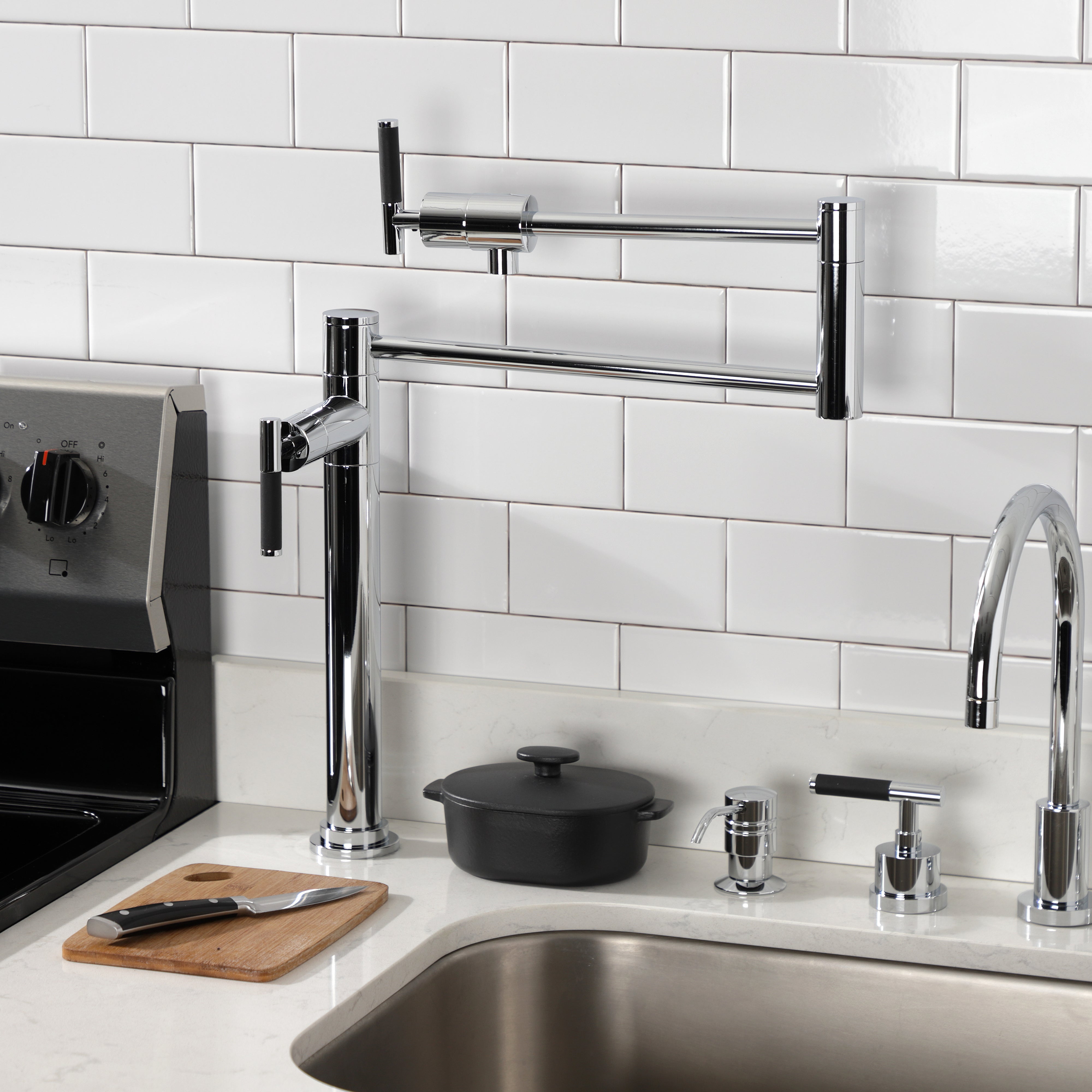 Kingston Brass KS4703CKL Kaiser Deck Mount Pot Filler Faucet, Antique Brass in a modern kitchen setting.