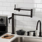 Kingston Brass KS4703DL Concord Deck Mount Pot Filler Faucet, Antique Brass in modern kitchen setting.