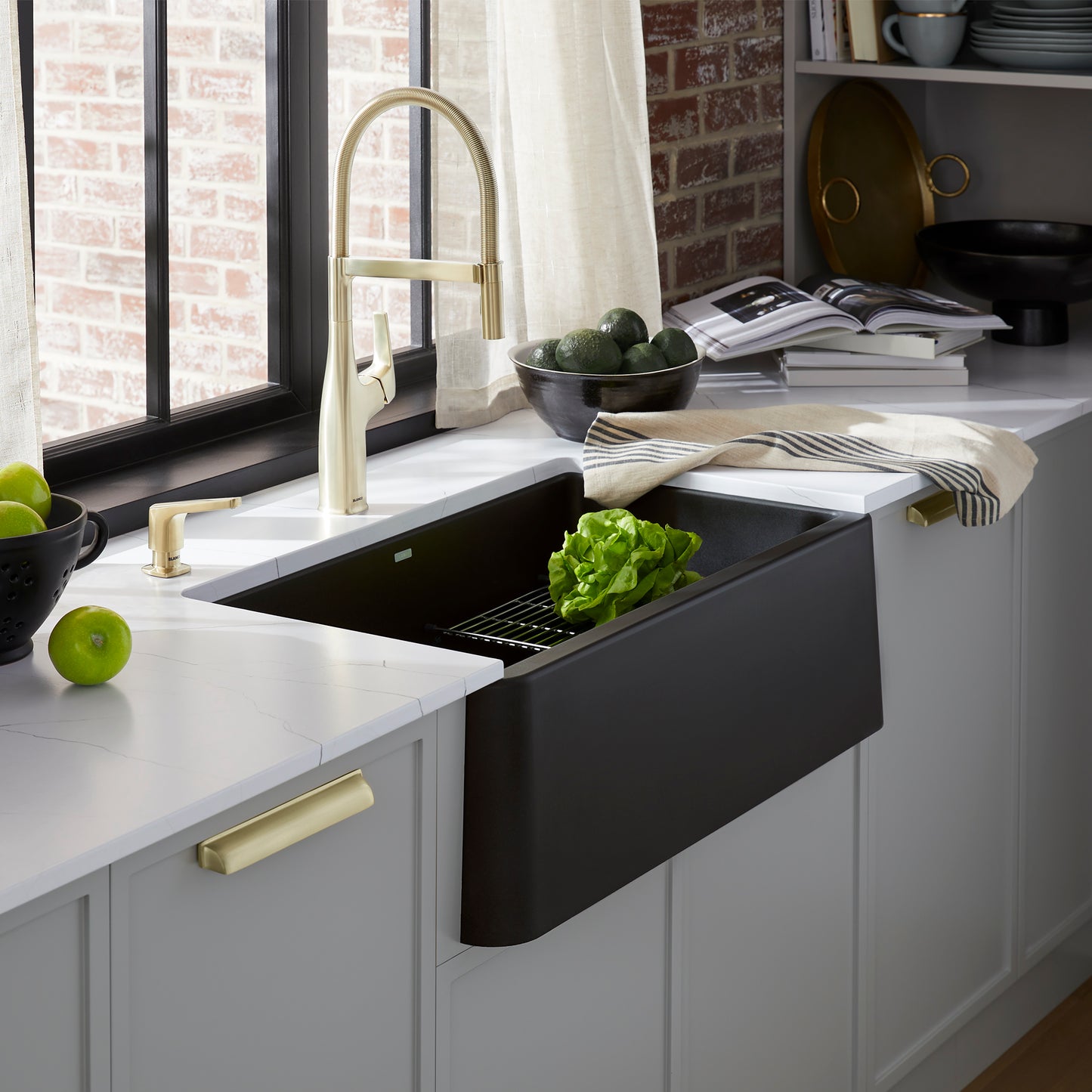 BLANCO Ikon SILGRANIT 30" Single Bowl Apron-Front Farmhouse Sink in a modern kitchen with fresh produce.