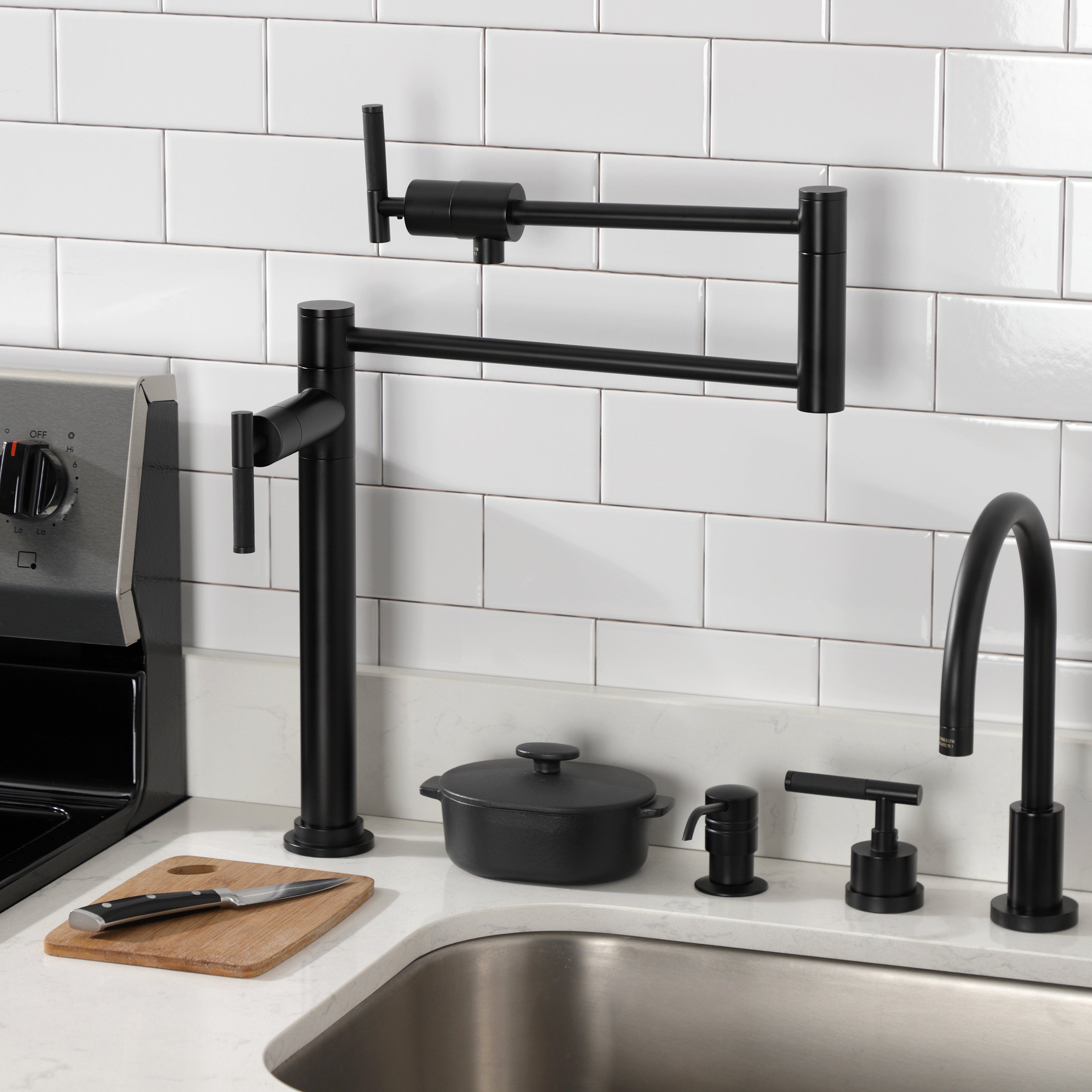 Kingston Brass KS4703CKL Kaiser Deck Mount Pot Filler Faucet, Antique Brass in a modern kitchen setting.