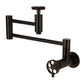 Kingston Brass KS8103RKX Webb Wall Mount Pot Filler Faucet with Knurled Handle, Antique Brass image showcasing swing arms and knurled handle.