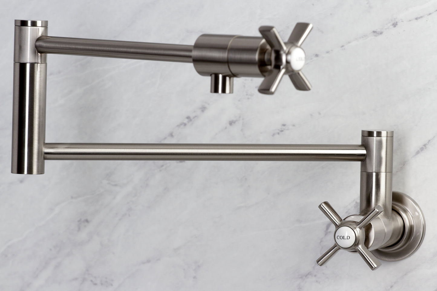 Kingston Brass KS4107ZX Millennium Wall Mount Pot Filler Faucet, Brushed Brass with cross handles and foldable swing arms.