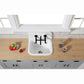 Kingston Brass KS814SB Concord Wall Mount Bridge Kitchen Faucet installed above a white sink on a wooden countertop.