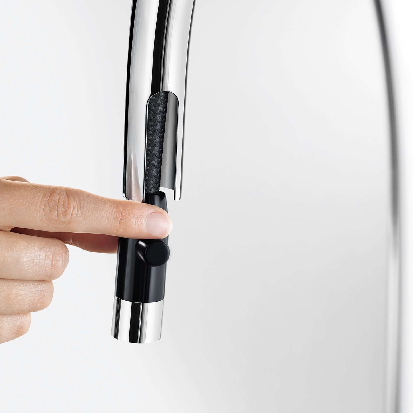 Close-up of BLANCO Urbena Pull-Down Dual-Spray Kitchen Faucet handle being operated.