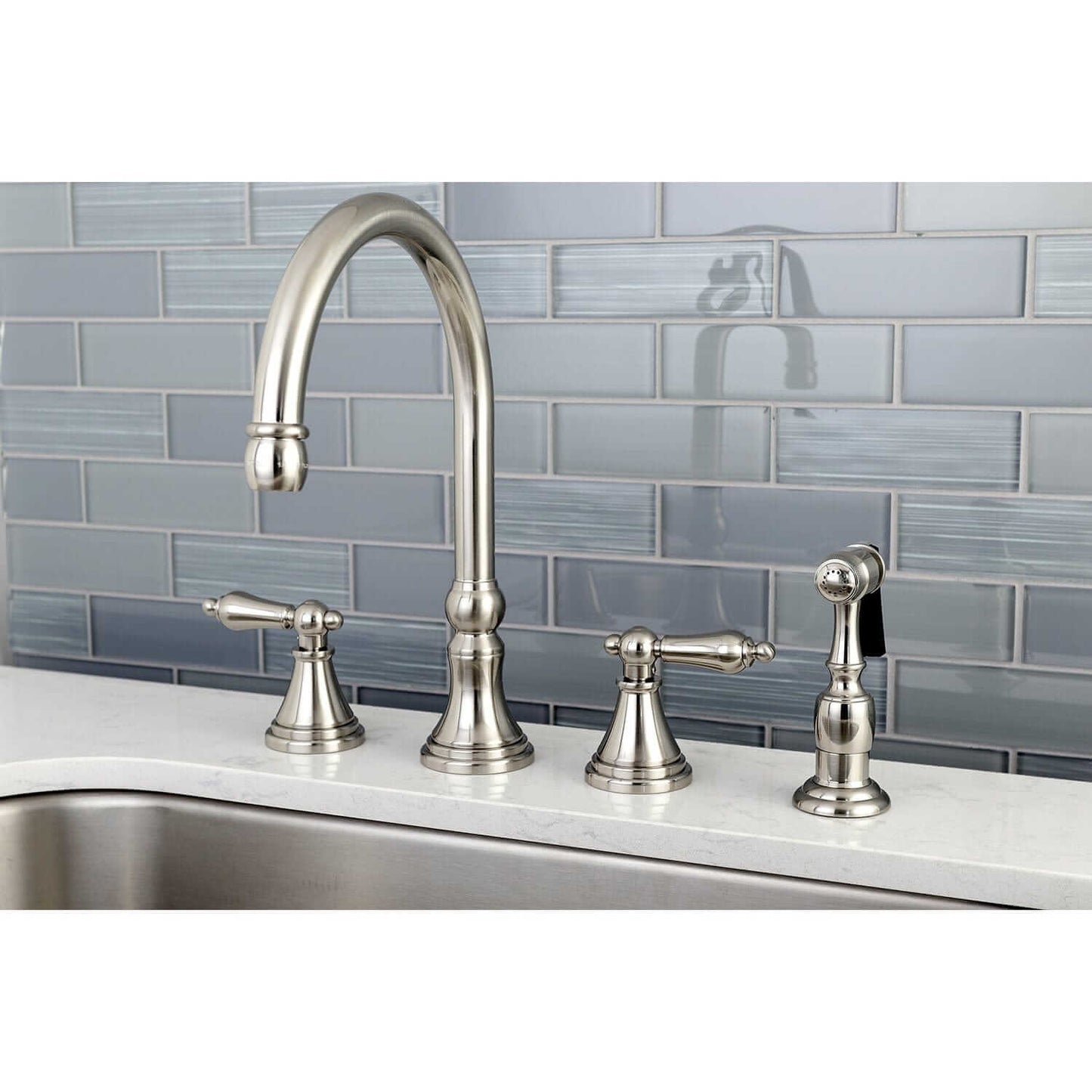 KINGSTON Brass Widespread Kitchen Faucet with Side Sprayer - KS2798ALBS close-up view with side sprayer and handles.