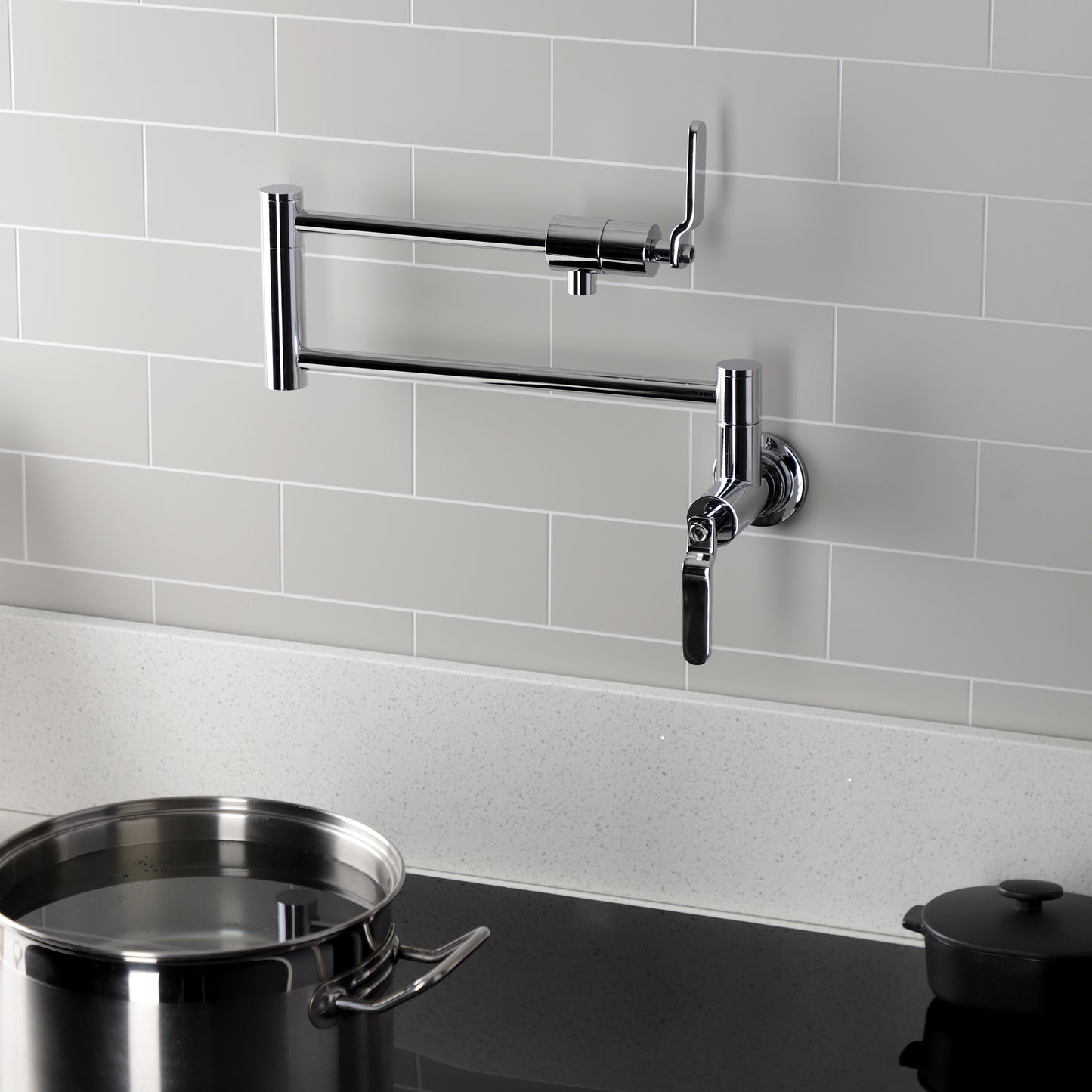 Kingston Brass KS4103KL Whitaker Wall Mount Pot Filler Faucet, Antique Brass installed in a kitchen with a pot.