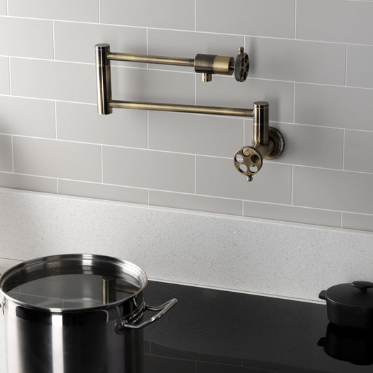 Kingston Brass KS4103RKX Webb Wall Mount Pot Filler Faucet with Knurled Handle, Antique Brass on a modern kitchen backsplash.