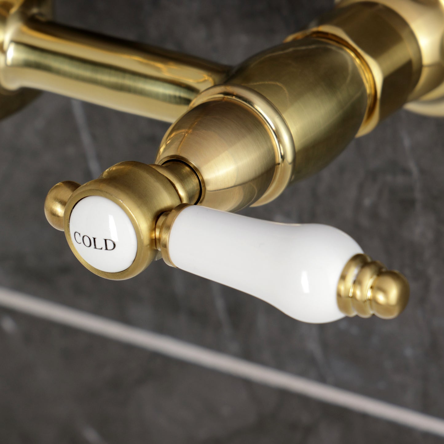 Kingston KS1263BPL Bel-Air Two-Handle Wall Mount Bridge Kitchen Faucet, Antique Brass Cold lever detail