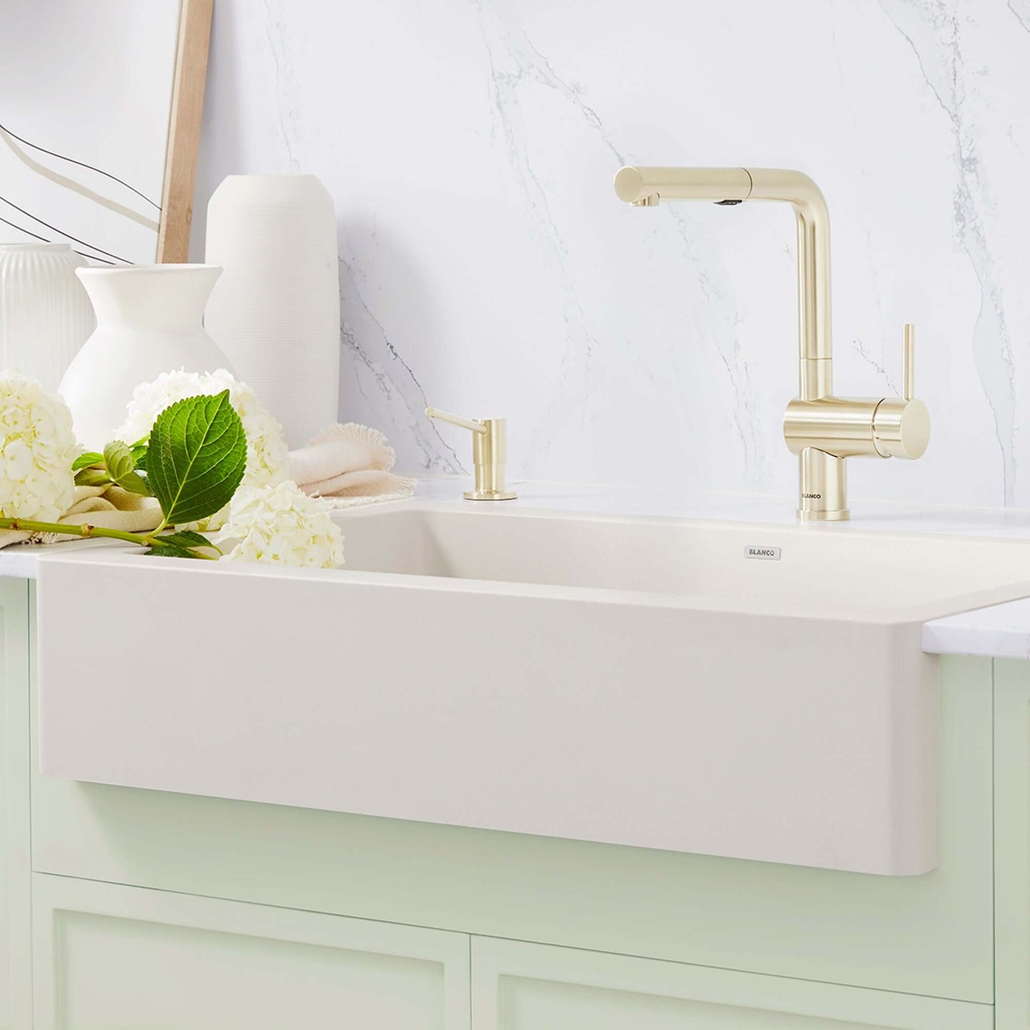 BLANCO VINTERA 30" SILGRANIT Single Bowl Farmhouse Sink with modern faucet and floral arrangement in kitchen.
