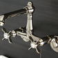 Kingston KS7220BEX Essex Two-Handle Wall Mount Bridge Kitchen Faucet, Matte Black with cross handles and sleek design.