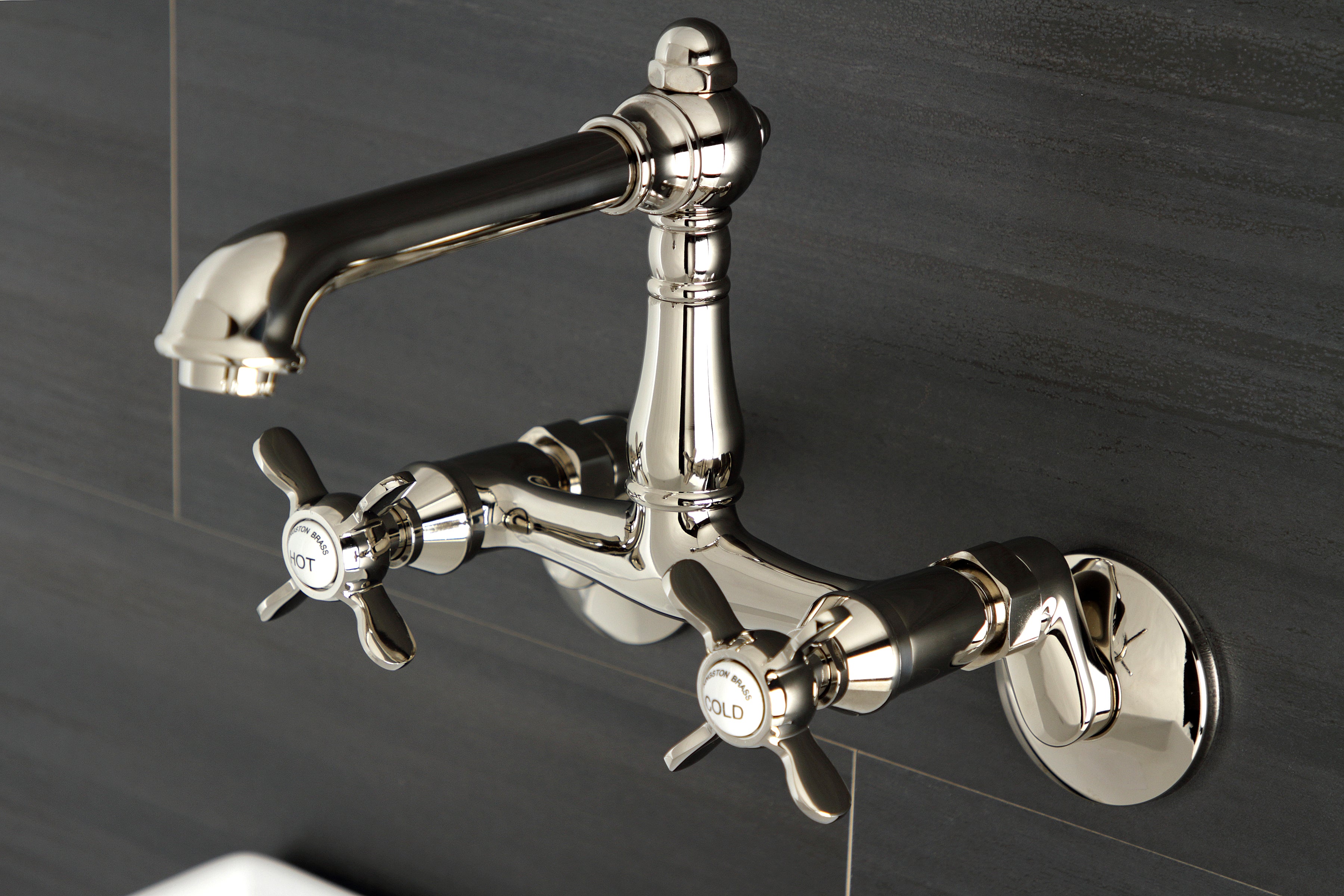 Kingston KS7220BEX Essex Two-Handle Wall Mount Bridge Kitchen Faucet, Matte Black with cross handles and sleek design.