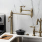 Kingston Brass KS3703AL Restoration Deck Mount Pot Filler Faucet, Antique Brass displayed in a modern kitchen setting.