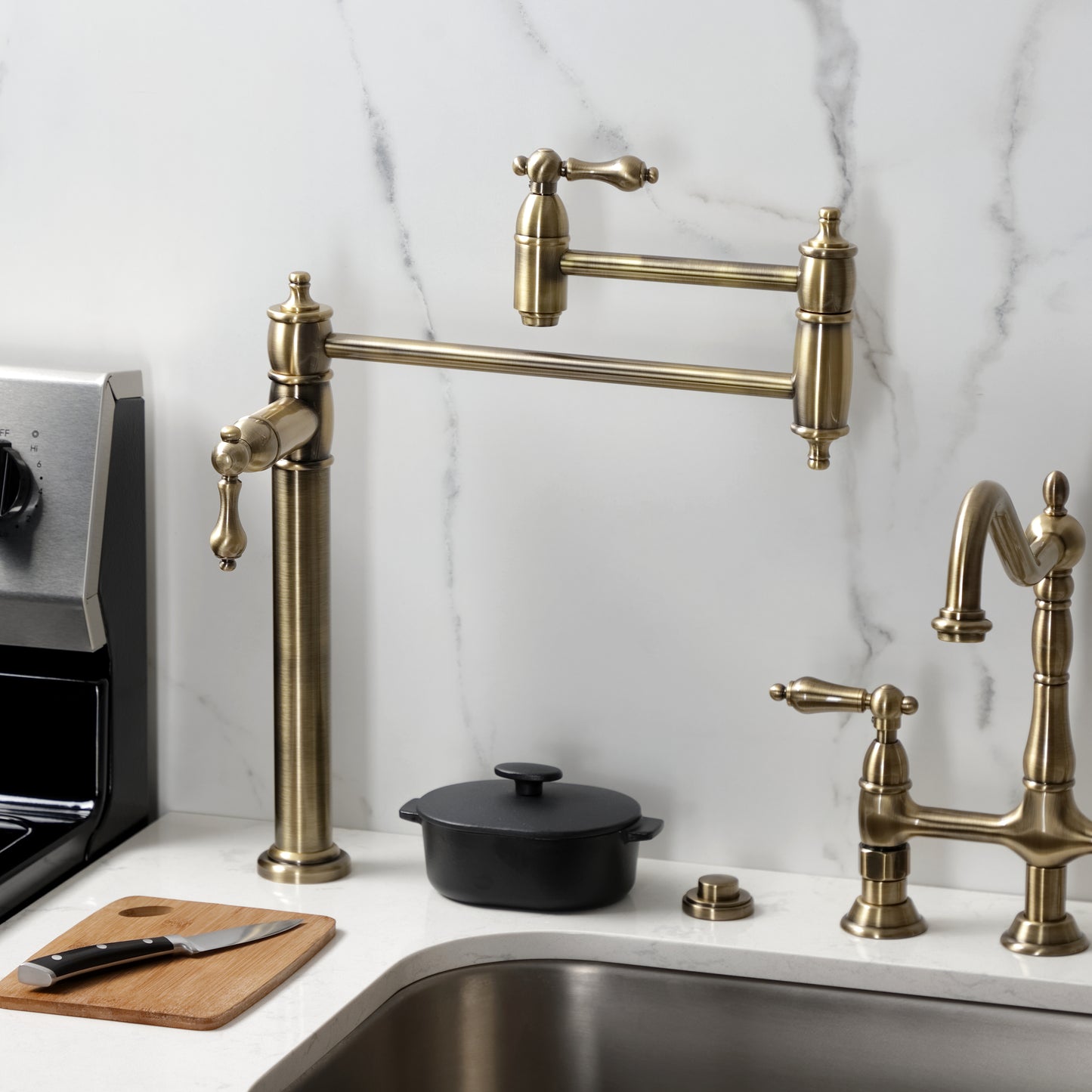 Kingston Brass KS3703AL Restoration Deck Mount Pot Filler Faucet, Antique Brass displayed in a modern kitchen setting.