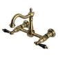 Kingston KS1263PKL Duchess Two-Handle Wall Mount Bridge Kitchen Faucet, Antique Brass with black porcelain handles