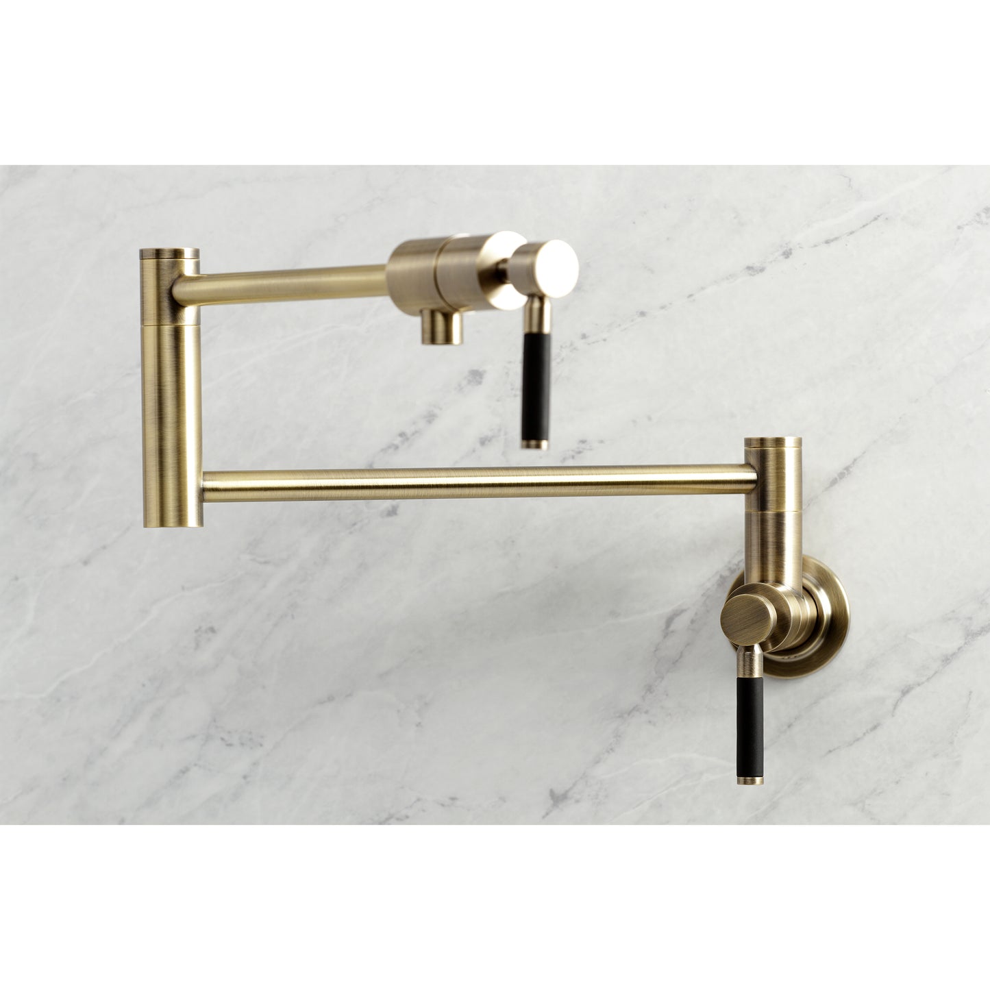 Kingston Brass KS4103DKL Kaiser Wall Mount Pot Filler Faucet, Antique Brass on marble background.